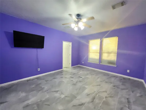 a view of an empty room with a window