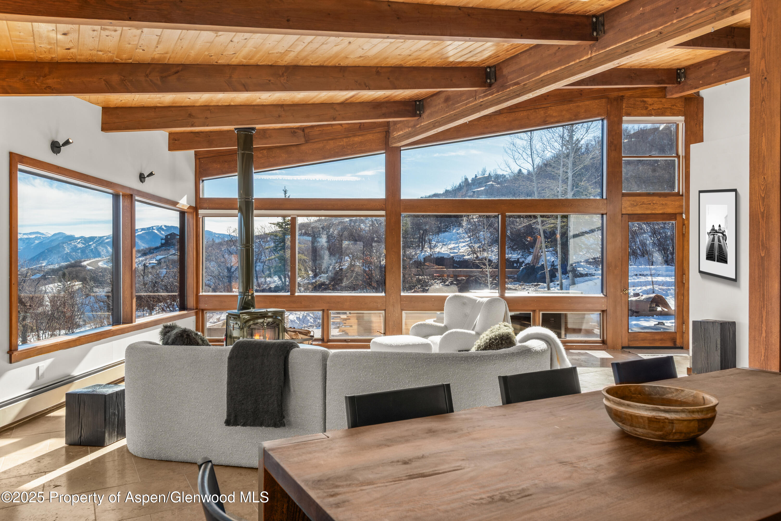 2227 Juniper Hill Road Aspen, CO 81611 - Photo 11 of 40 a living room with furniture and a floor to ceiling window