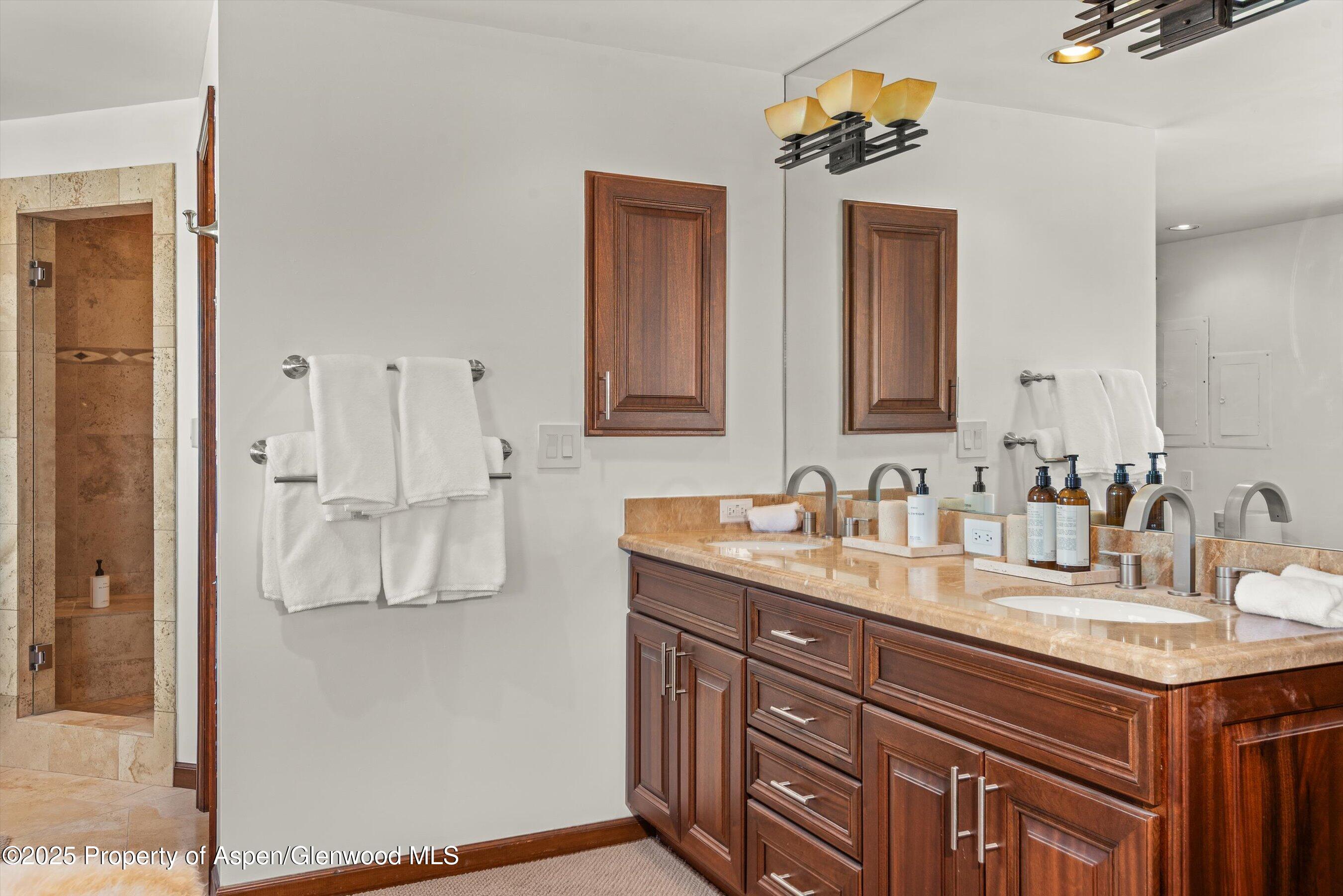 2227 Juniper Hill Road Aspen, CO 81611 - Photo 24 of 40 a bathroom with a sink vanity granite and a mirror