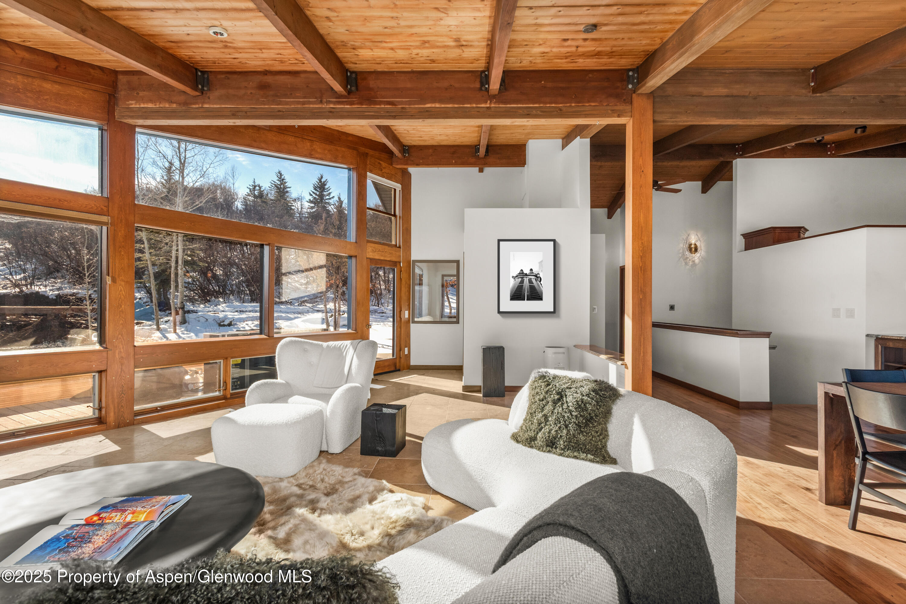 2227 Juniper Hill Road Aspen, CO 81611 - Photo 6 of 40 a living room with furniture and a large window