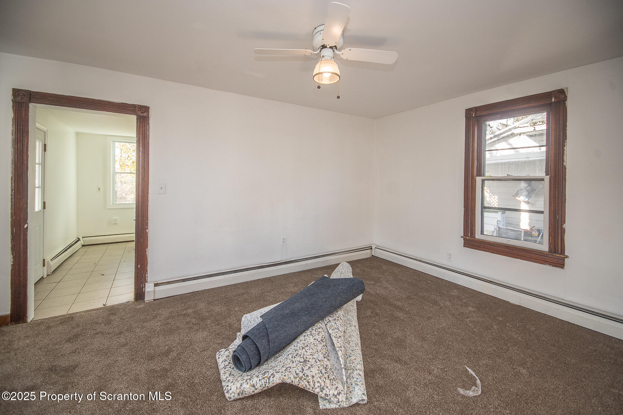 1227 Rundle Street Scranton, PA 18504 - Photo 20 of 43 a view of a room with a ceiling fan and a window