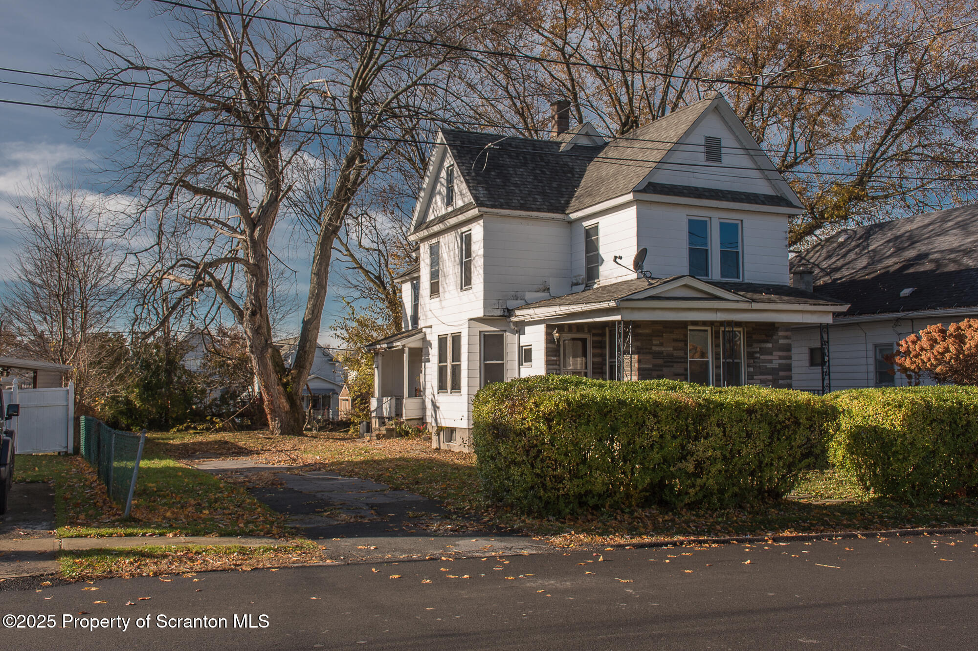 1227 Rundle Street Scranton, PA 18504 - Photo 2 of 43 a front view of a house with a garden