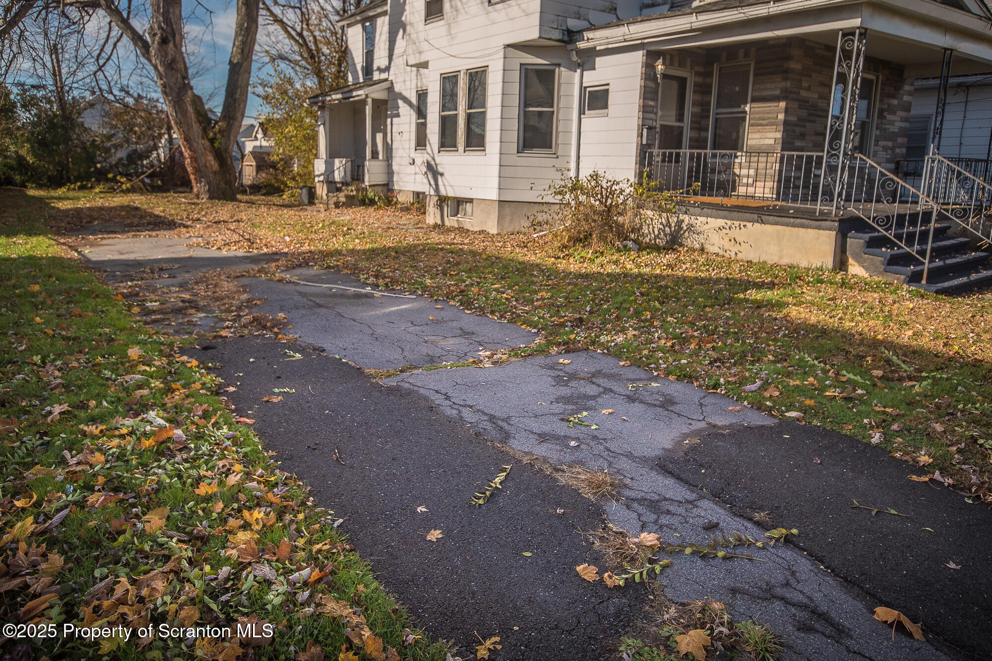 1227 Rundle Street Scranton, PA 18504 - Photo 5 of 43 a front view of a house with a yard