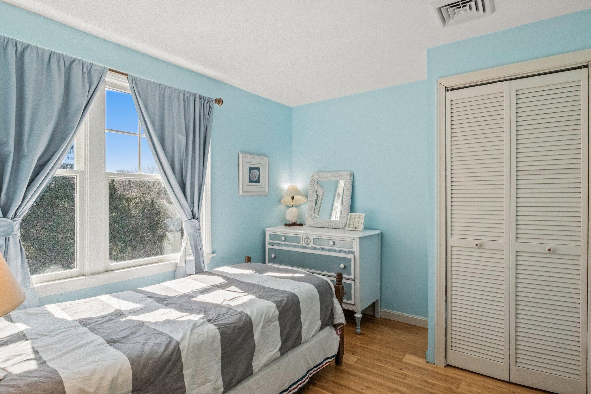 153 Long Road Harwich Port, MA 02646 - Photo 27 of 44 a bedroom with a bed and wooden floor