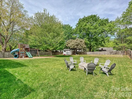a view of a garden with chairs