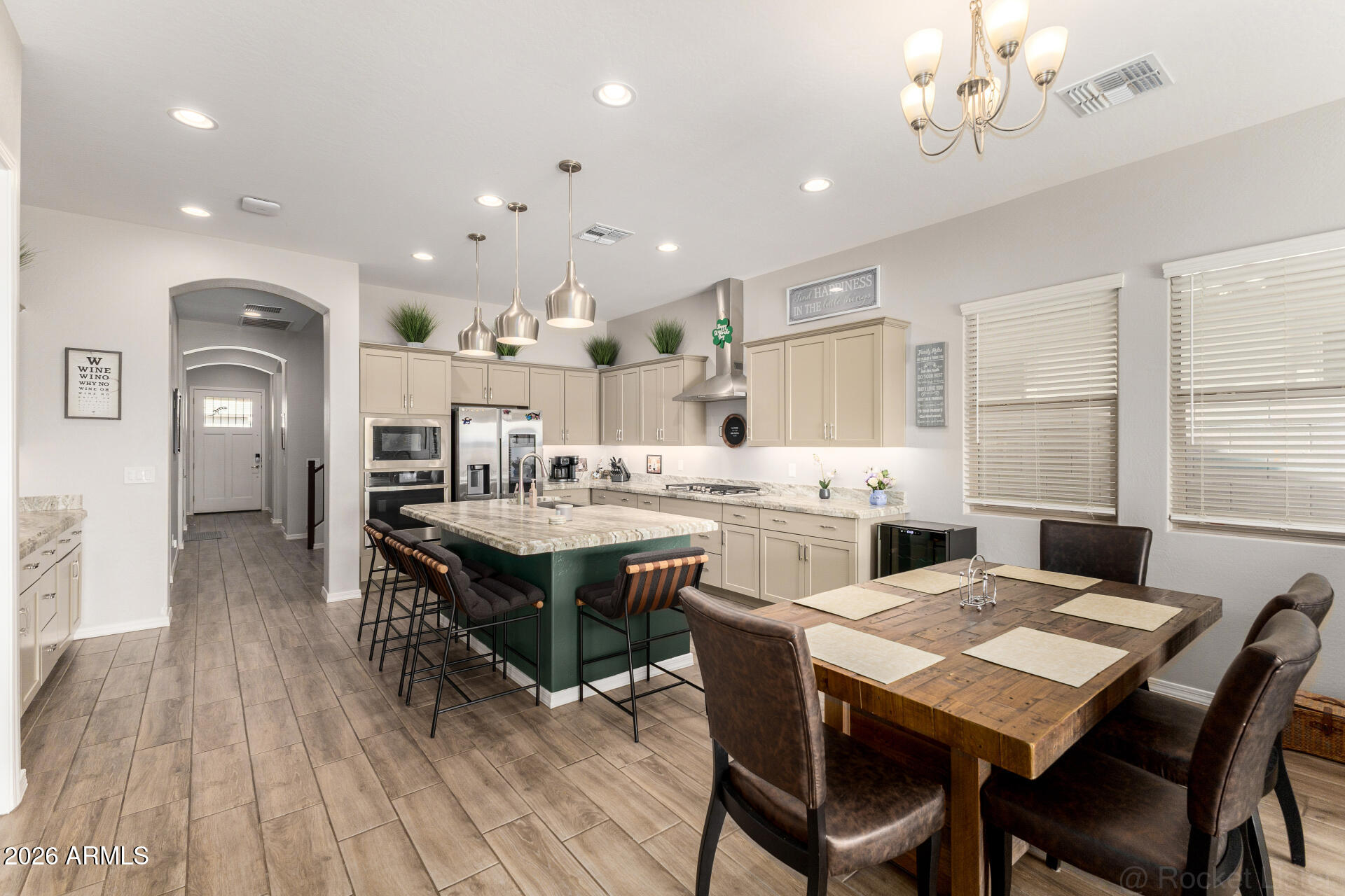 23135 East Thornton Road Queen Creek, AZ 85142 - Photo 13 of 61 a large kitchen with a table and chairs
