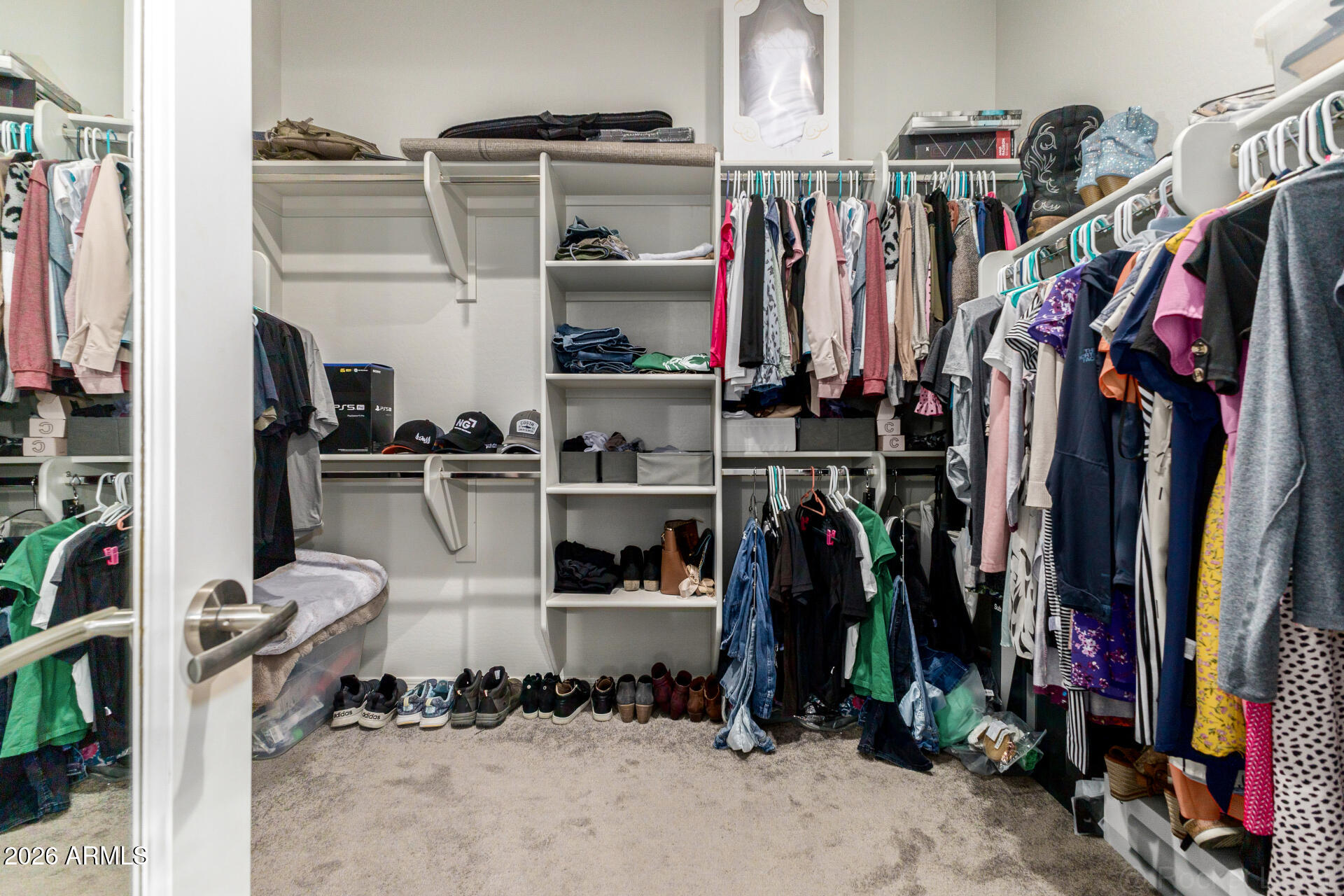 23135 East Thornton Road Queen Creek, AZ 85142 - Photo 26 of 61 a view of walk in closet with clothes and shoes