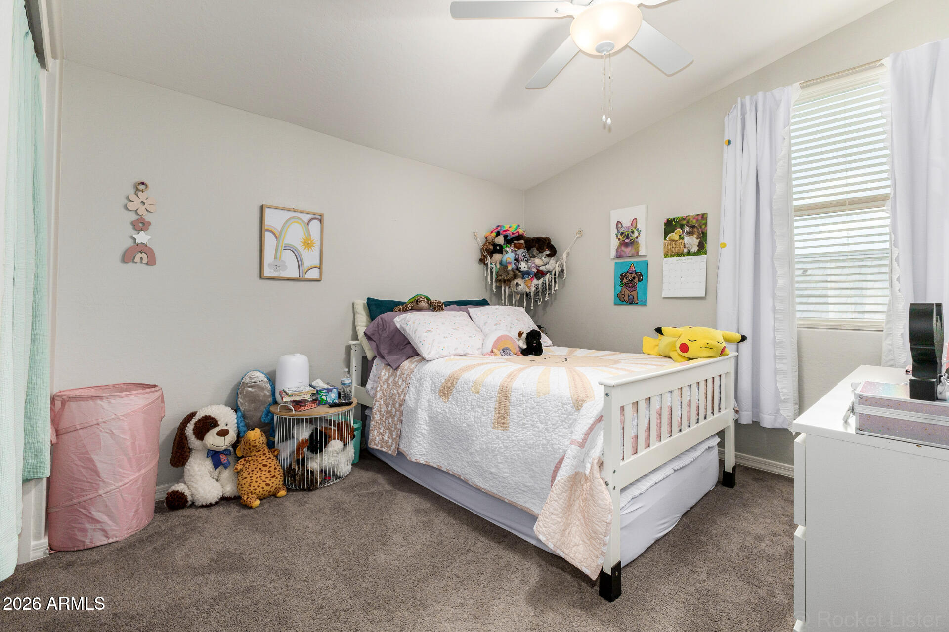 23135 East Thornton Road Queen Creek, AZ 85142 - Photo 27 of 61 a bed sitting in a bedroom next to a window