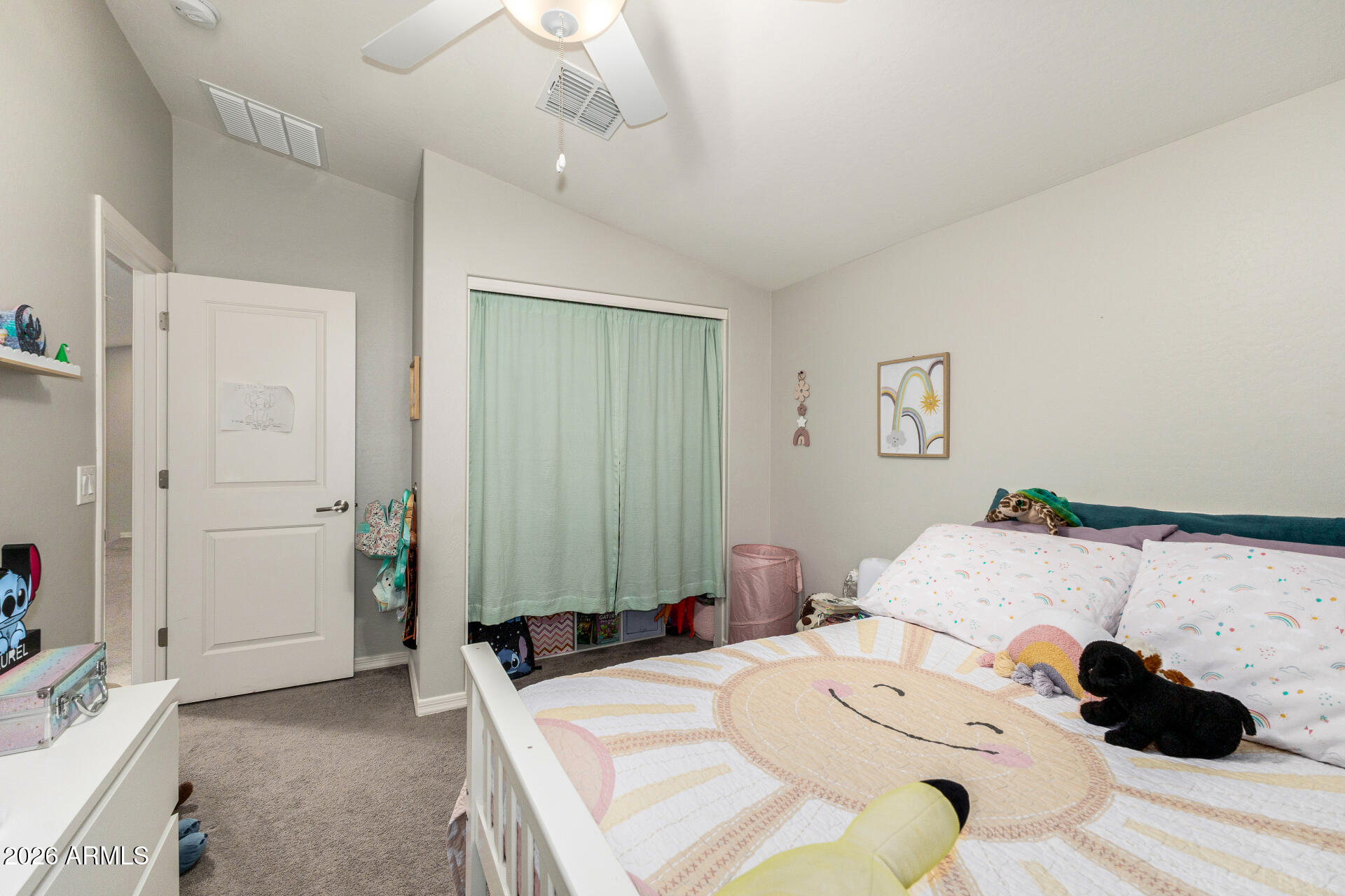 23135 East Thornton Road Queen Creek, AZ 85142 - Photo 28 of 61 a bedroom with a bed and a chandelier