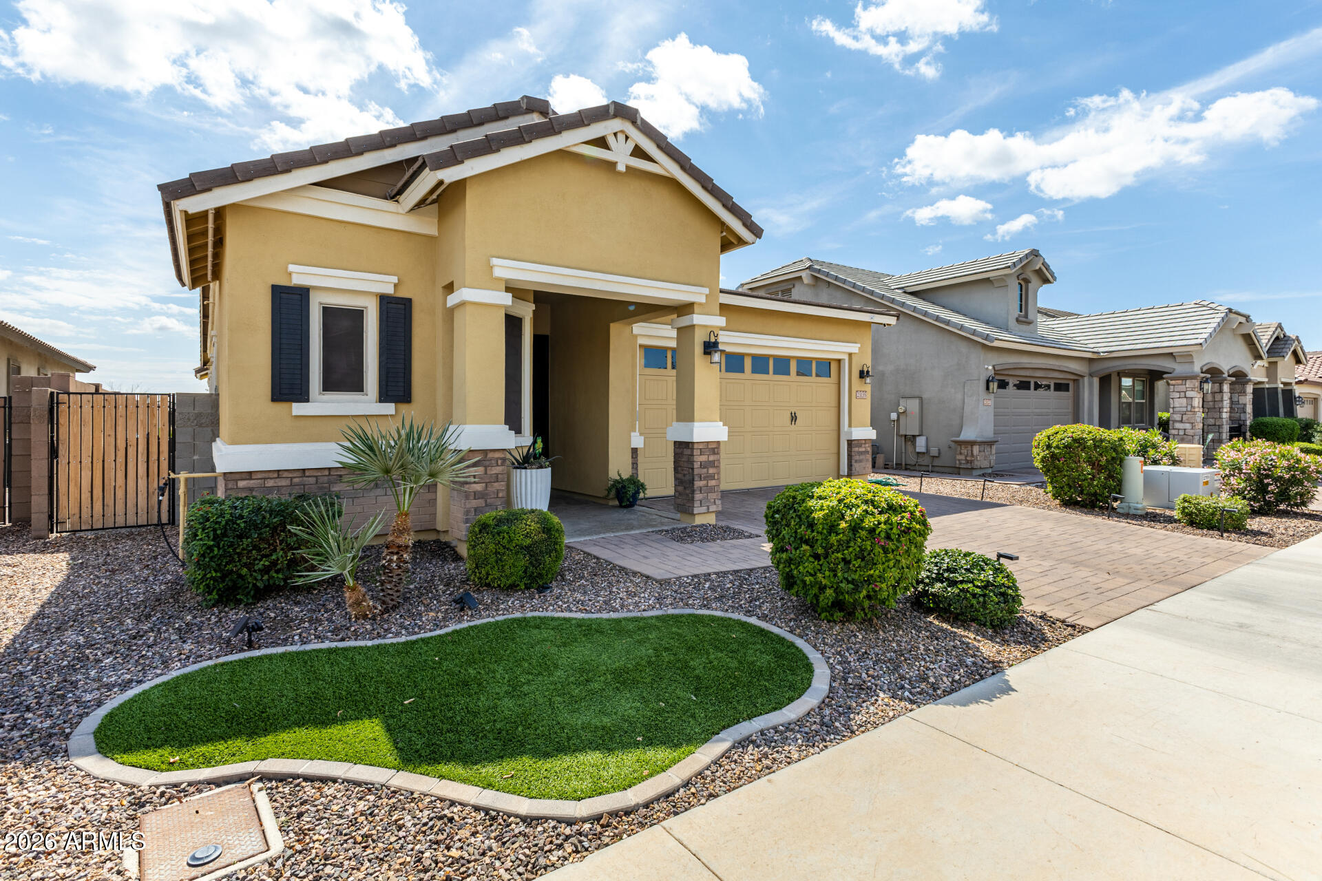 23135 East Thornton Road Queen Creek, AZ 85142 - Photo 4 of 61 a view of a house with a small yard and plants