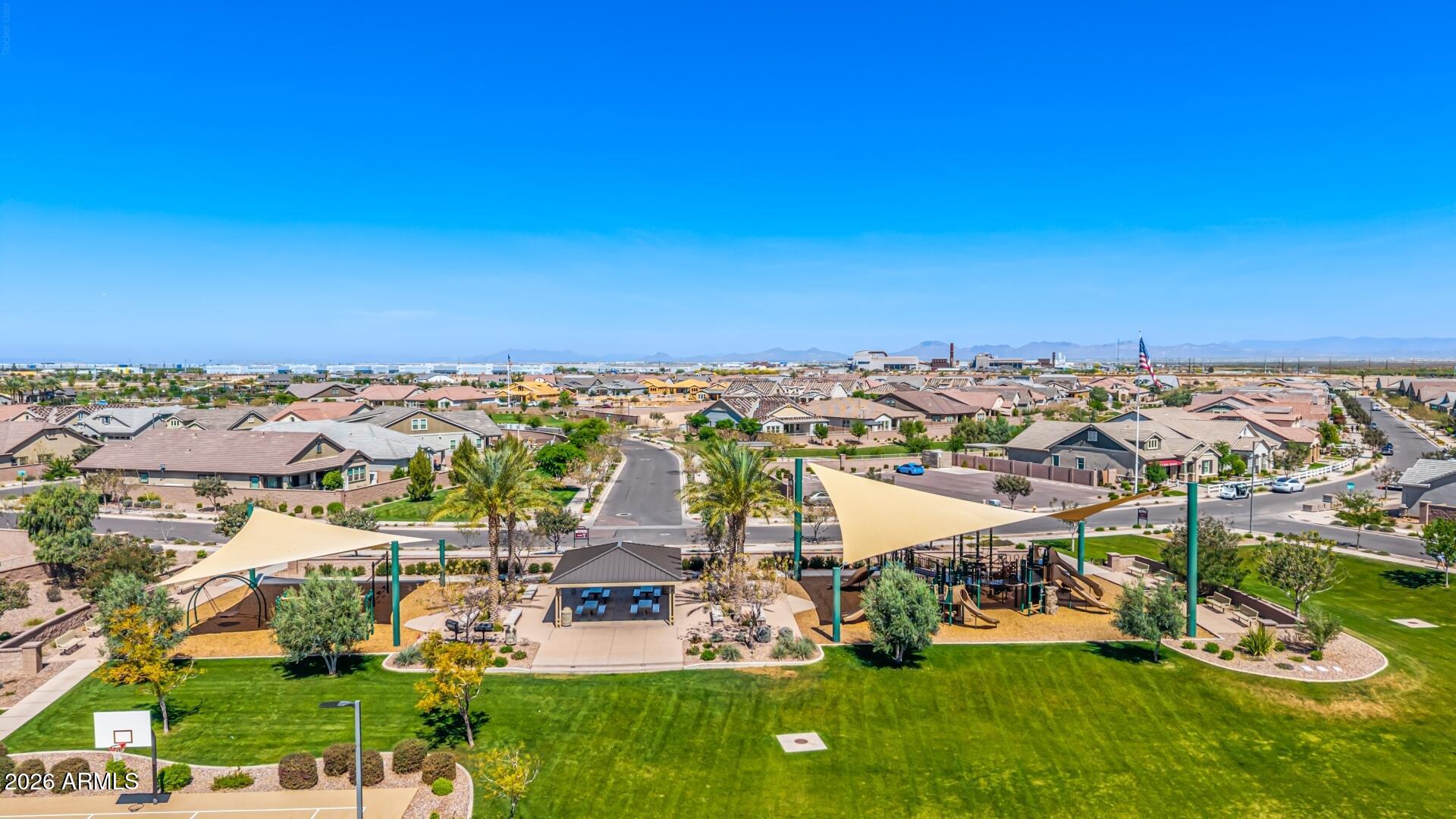 23135 East Thornton Road Queen Creek, AZ 85142 - Photo 51 of 61 an aerial view of a city with lots of residential buildings ocean and mountain view in back