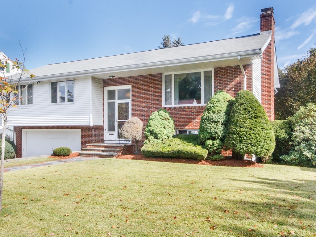 14 Taylor Road Belmont, MA 02478 - Photo 1 of 14 a front view of a house with garden