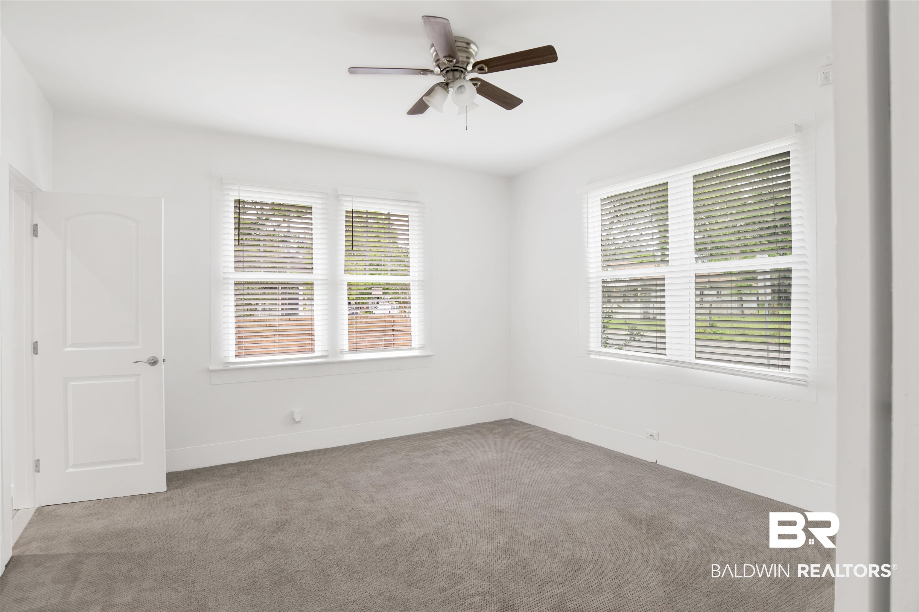 507 Holcombe Avenue Mobile, AL 36606 - Photo 23 of 28 Unfurnished room with carpet flooring, a ceiling fan, and baseboards