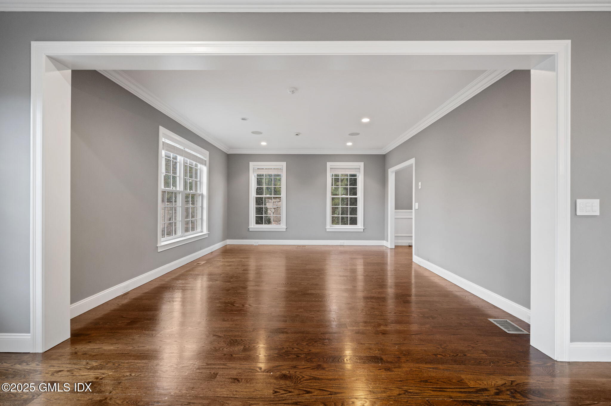 12 Cognewaugh Road Cos Cob, CT 06807 - Photo 13 of 48 a view of empty room with wooden floor and fan