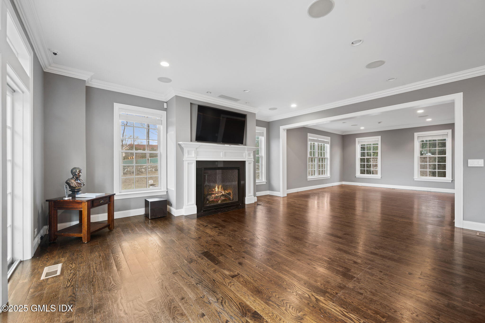12 Cognewaugh Road Cos Cob, CT 06807 - Photo 14 of 48 a view of empty room with fireplace and wooden floor