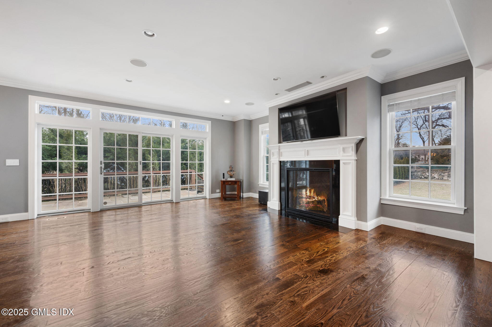 12 Cognewaugh Road Cos Cob, CT 06807 - Photo 15 of 48 a view of an empty room with wooden floor and a window