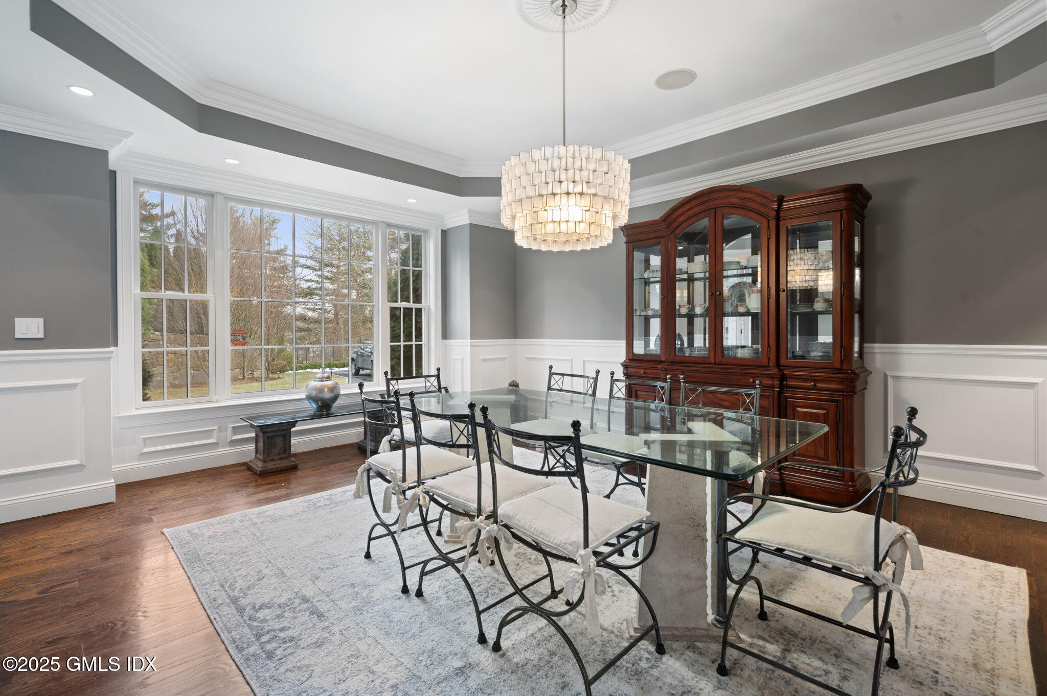12 Cognewaugh Road Cos Cob, CT 06807 - Photo 21 of 48 a view of a dining room with furniture wooden floor and chandelier