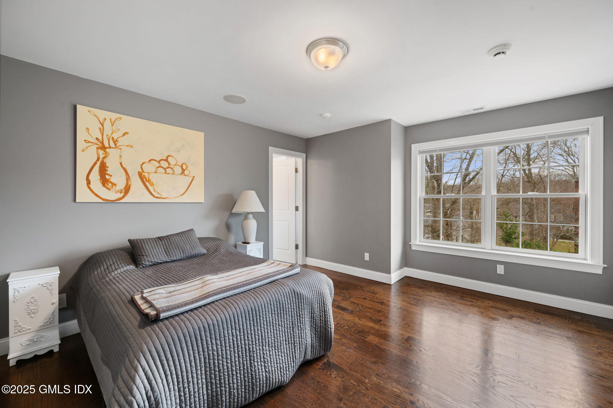 12 Cognewaugh Road Cos Cob, CT 06807 - Photo 28 of 48 a bedroom with a bed and wooden floor