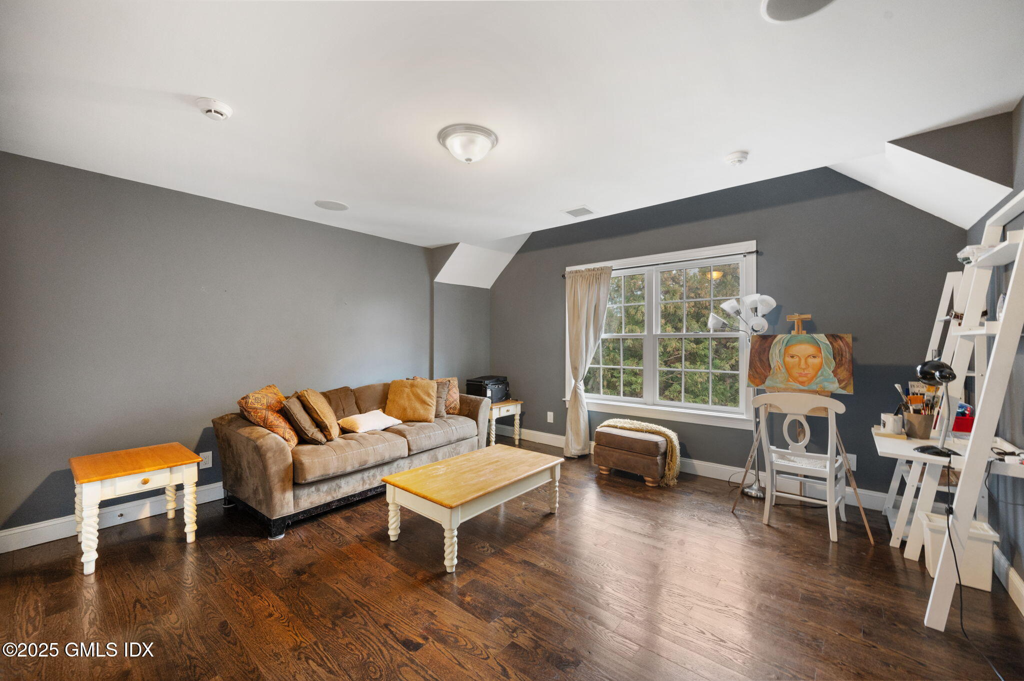 12 Cognewaugh Road Cos Cob, CT 06807 - Photo 29 of 48 a living room with furniture a flat screen tv and a large window