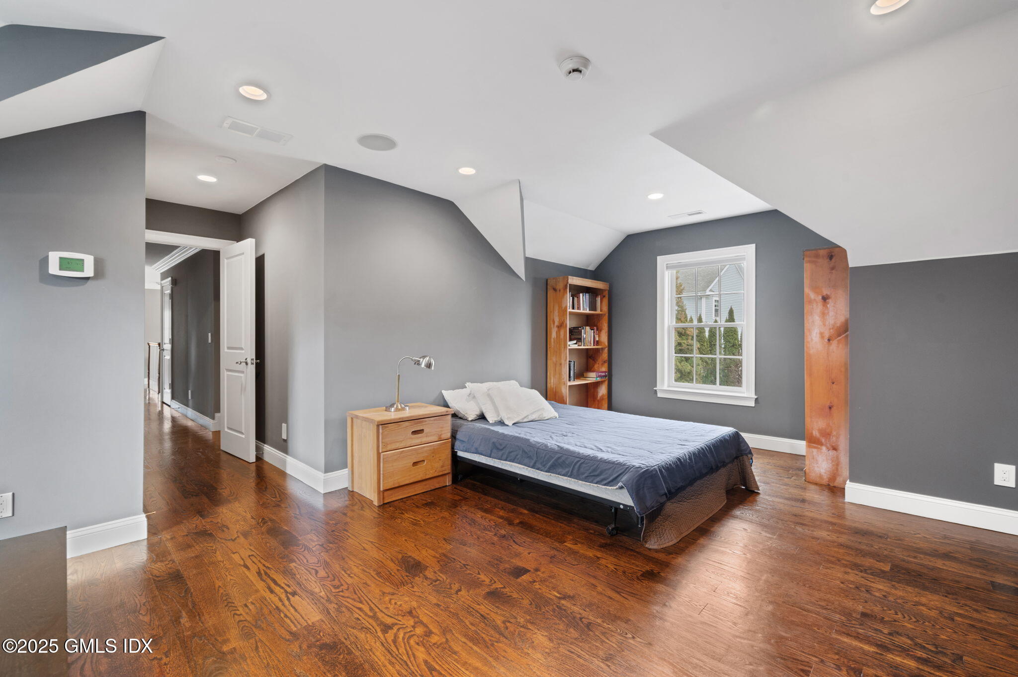 12 Cognewaugh Road Cos Cob, CT 06807 - Photo 30 of 48 a spacious bedroom with a bed and window