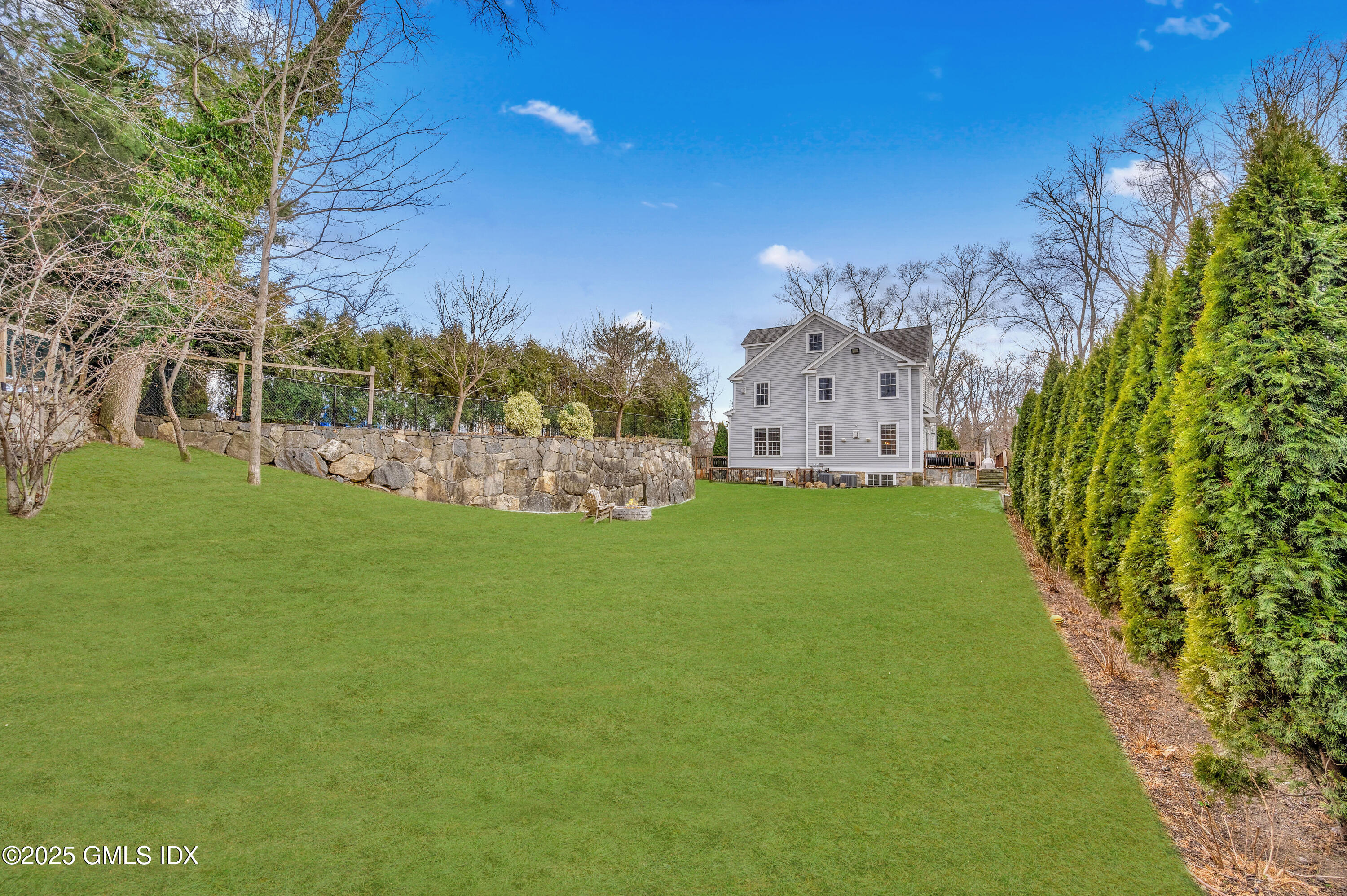 12 Cognewaugh Road Cos Cob, CT 06807 - Photo 3 of 48 a view of a house with a big yard