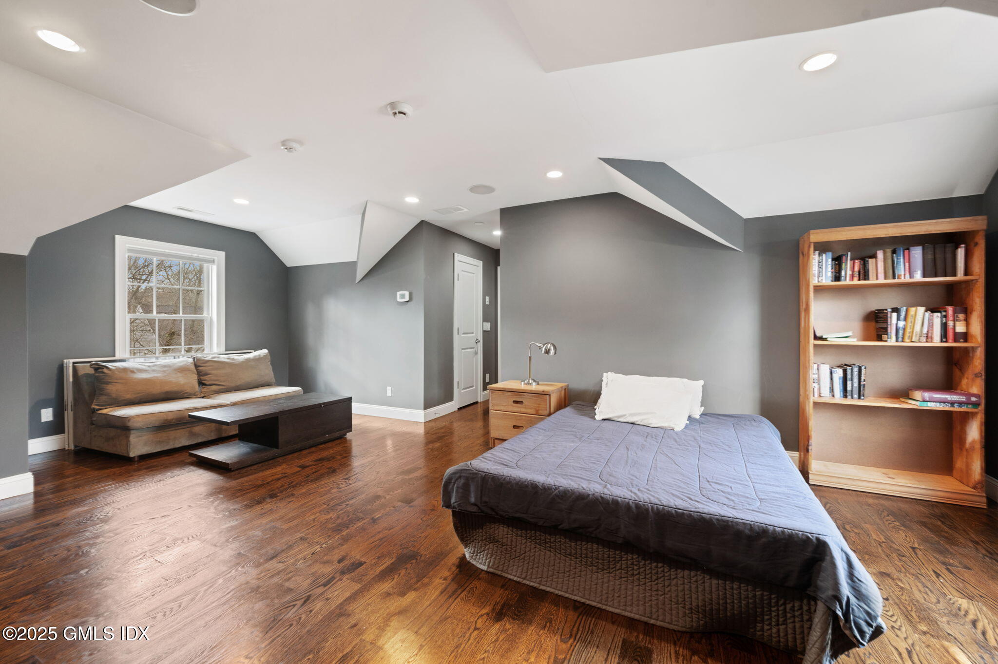 12 Cognewaugh Road Cos Cob, CT 06807 - Photo 31 of 48 a bedroom with a bed and a wooden floor