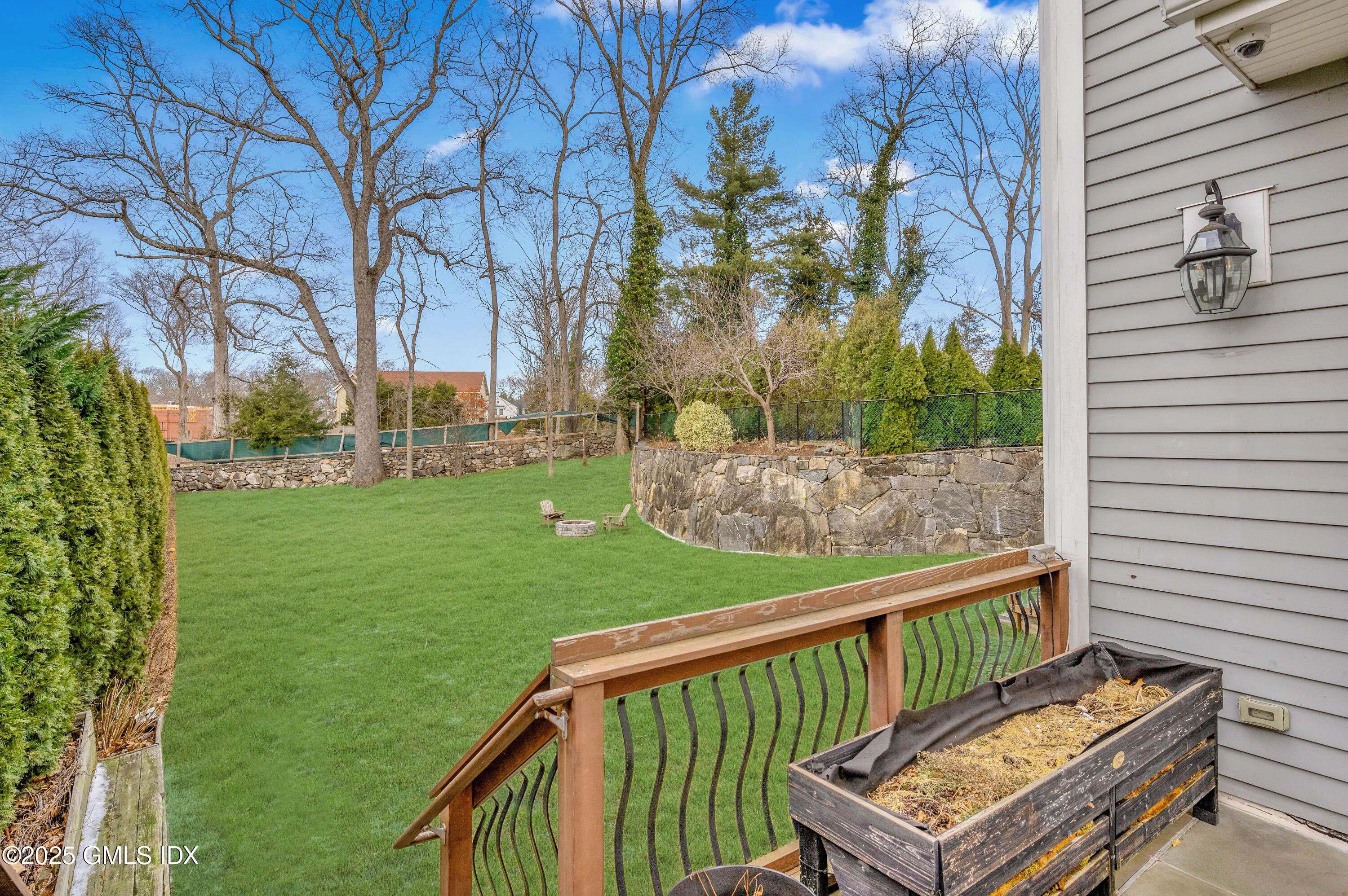 12 Cognewaugh Road Cos Cob, CT 06807 - Photo 4 of 48 a view of a two chairs in the deck