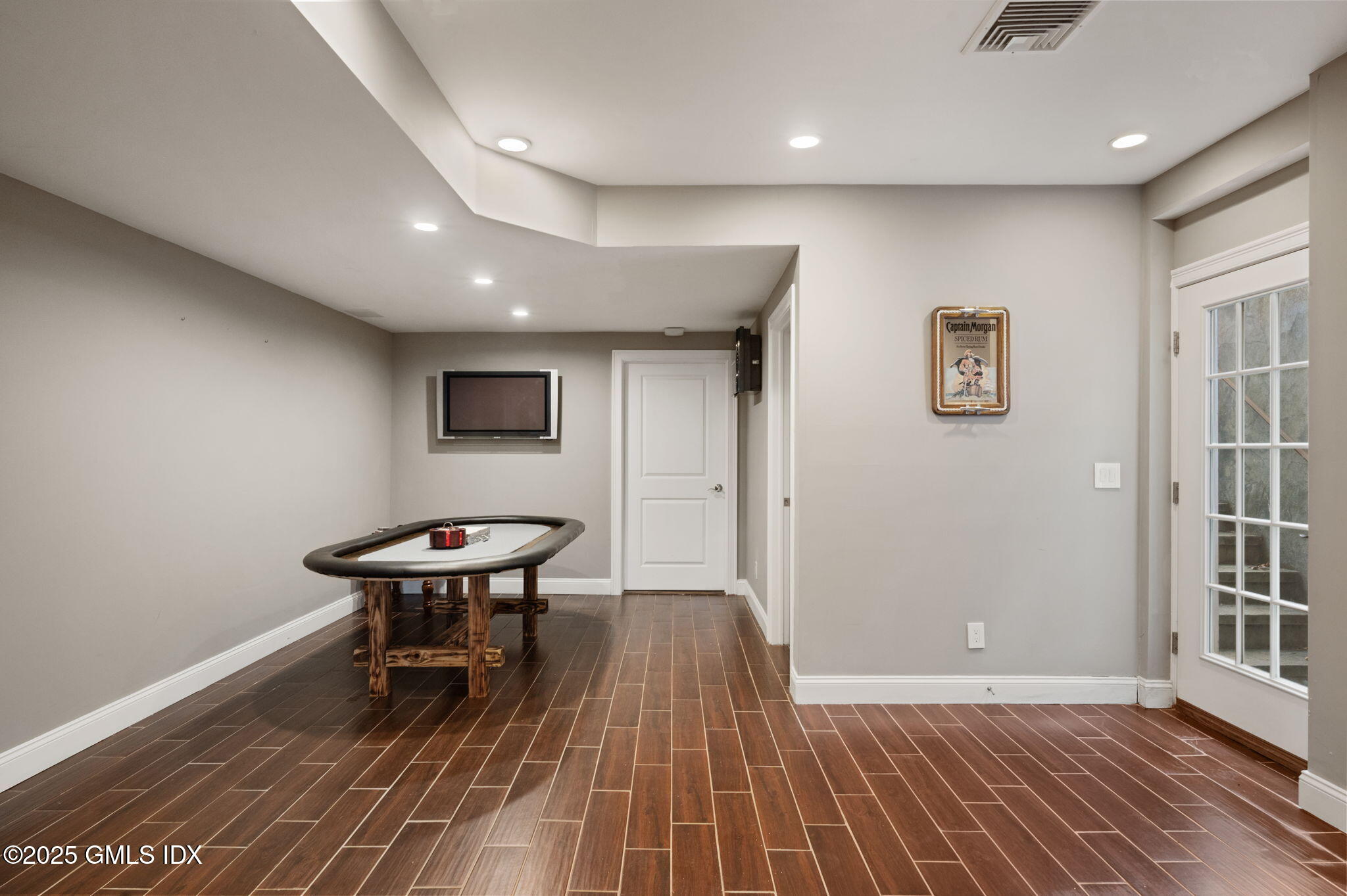 12 Cognewaugh Road Cos Cob, CT 06807 - Photo 45 of 48 an empty room with wooden floor and a swing