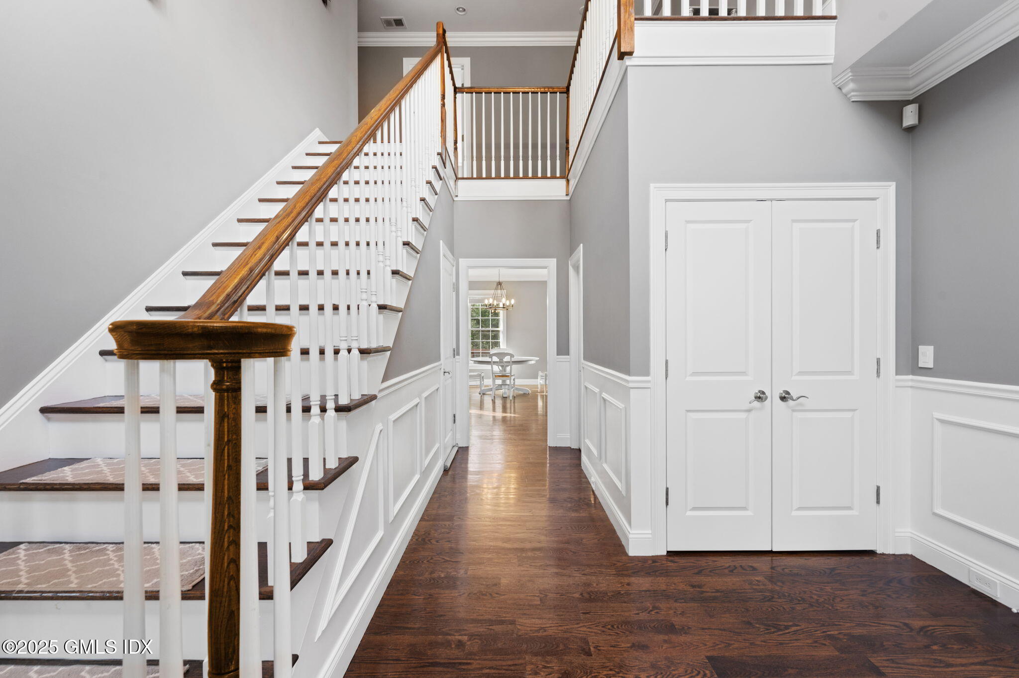12 Cognewaugh Road Cos Cob, CT 06807 - Photo 10 of 48 a view of staircase with white walls and wooden floor