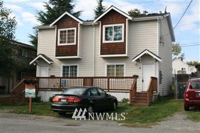 1310 Chestnut Street Everett, WA 98201 - Photo 1 of 1 a front view of a house with a garden and deck
