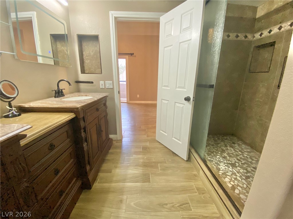 2000 Turquoise Ridge Street, Unit 204 Las Vegas, NV 89117 - Photo 7 of 29 Elegant custom vanity with a walk-in shower for a relaxing daily routine.