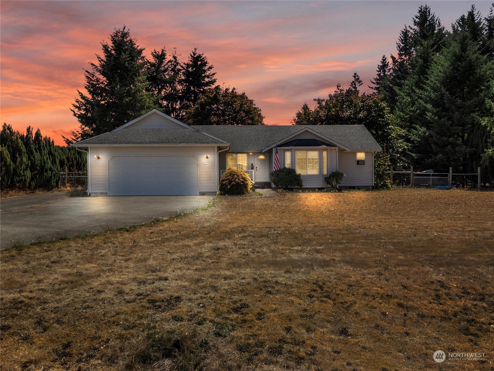 8643 194th Avenue Southwest Rochester, WA 98579 - Photo 1 of 28 a front view of a house with a yard and trees