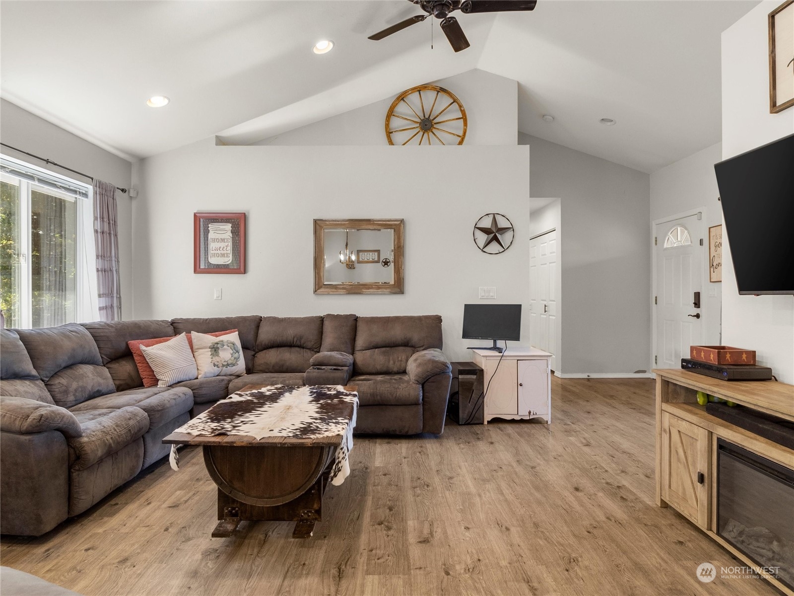 8643 194th Avenue Southwest Rochester, WA 98579 - Photo 13 of 28 a living room with furniture and a flat screen tv