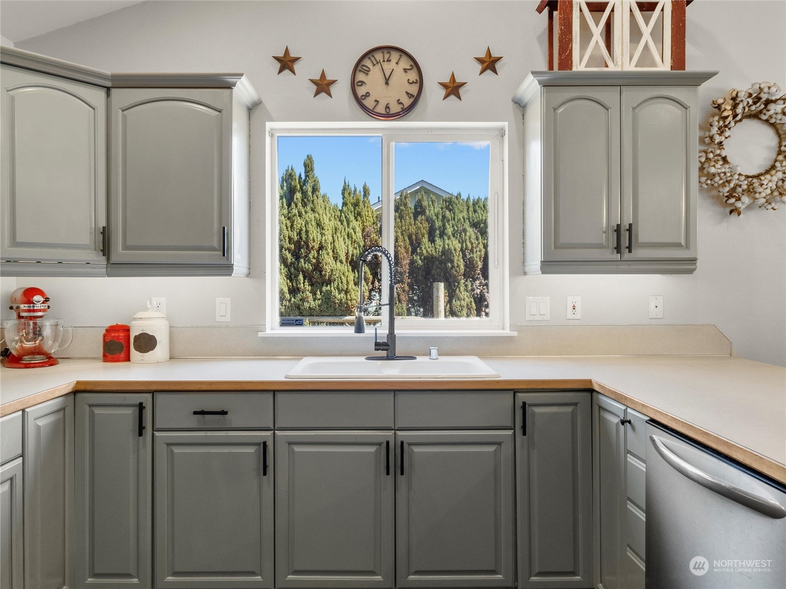 8643 194th Avenue Southwest Rochester, WA 98579 - Photo 16 of 28 a kitchen with a sink cabinets and a window