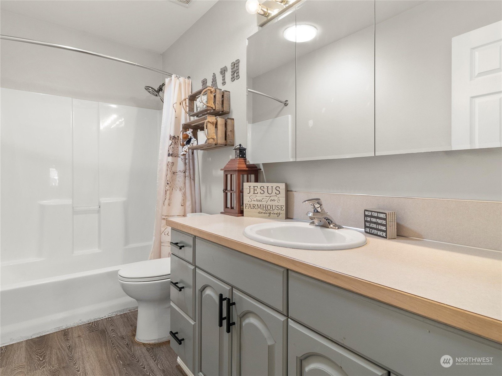 8643 194th Avenue Southwest Rochester, WA 98579 - Photo 22 of 28 a bathroom with a sink toilet vanity and tub