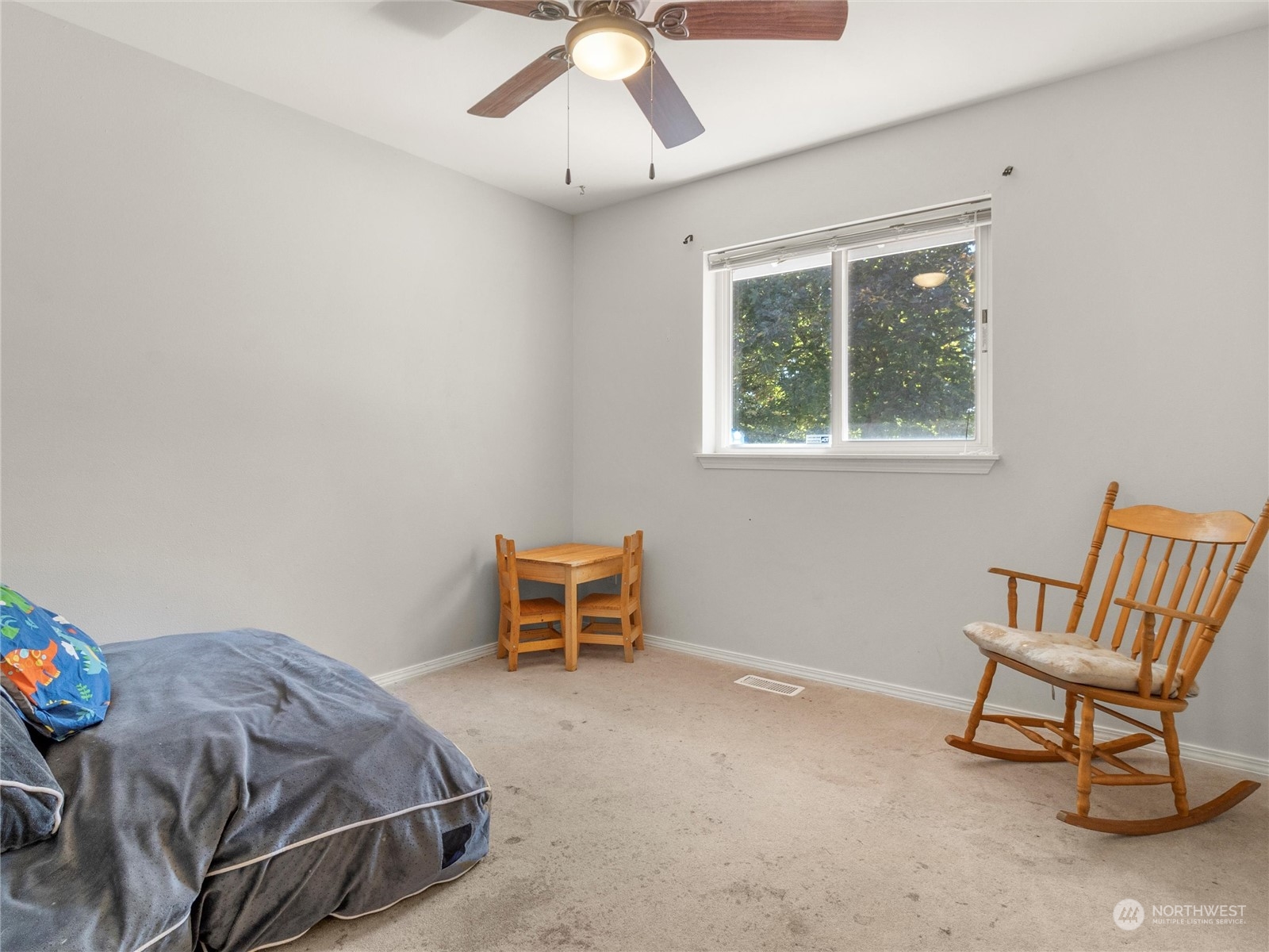 8643 194th Avenue Southwest Rochester, WA 98579 - Photo 23 of 28 a bedroom with a bed and a chair