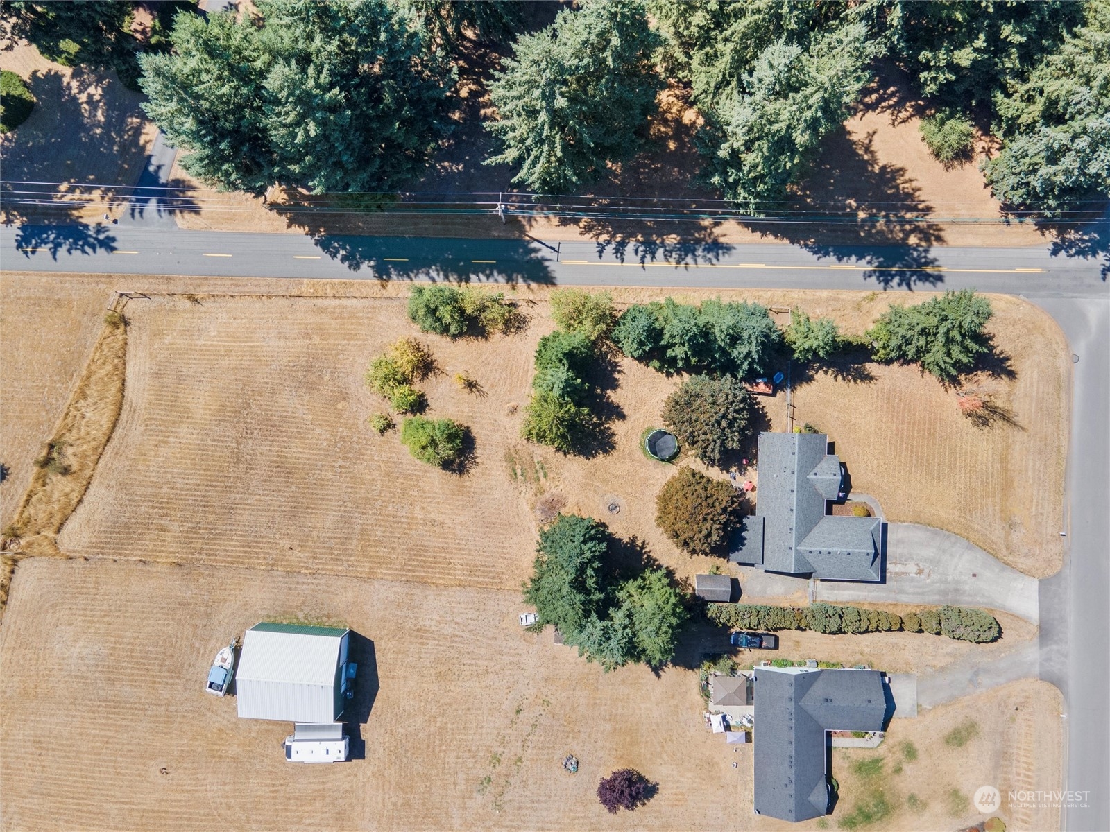 8643 194th Avenue Southwest Rochester, WA 98579 - Photo 4 of 28 an aerial view of residential houses with outdoor space
