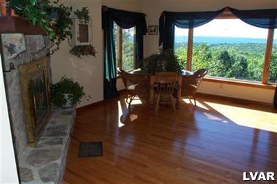 6379 Five Springs Road Shavertown, PA 18708 - Photo 11 of 35 a living room with furniture and a floor to ceiling window
