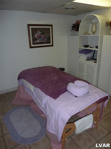 6379 Five Springs Road Shavertown, PA 18708 - Photo 13 of 35 a bedroom with a bed and a mirror
