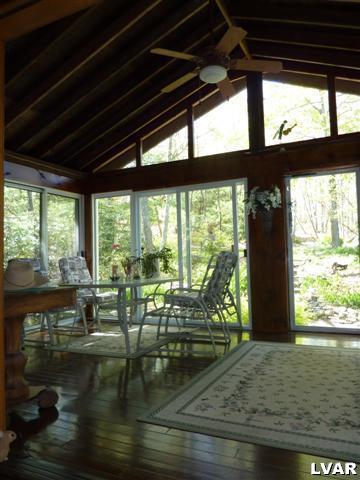 6379 Five Springs Road Shavertown, PA 18708 - Photo 17 of 35 a living room with hardwood floor and a floor to ceiling window
