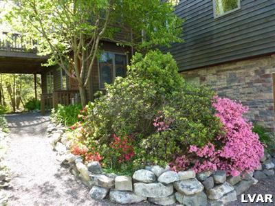 6379 Five Springs Road Shavertown, PA 18708 - Photo 28 of 35 a bunch of flowers are in front of a house