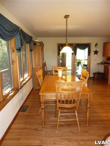 6379 Five Springs Road Shavertown, PA 18708 - Photo 10 of 35 a dining room with wooden floor table and chairs