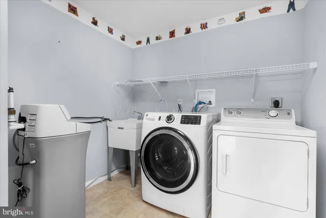 a utility room with dryer and washer