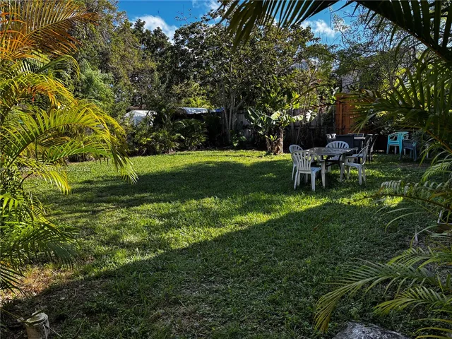 a view of a park with large trees