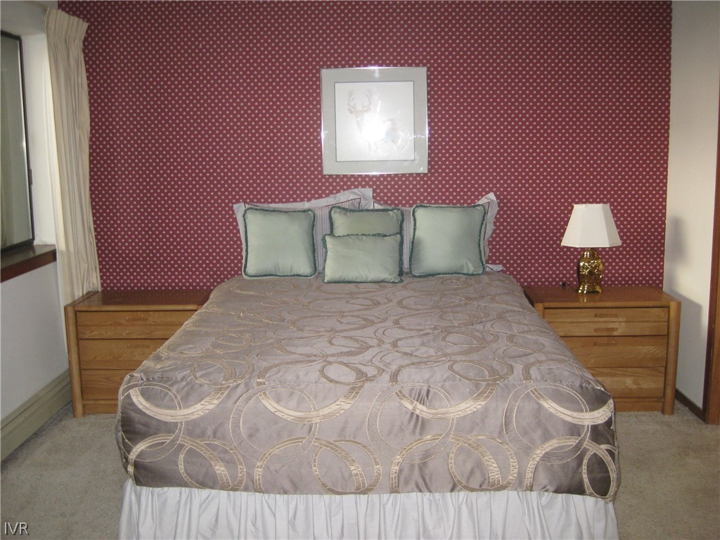 335 Ski Way, Unit 314 Incline Village, NV 89451 - Photo 2 of 15 a bedroom with a bed and a night stand