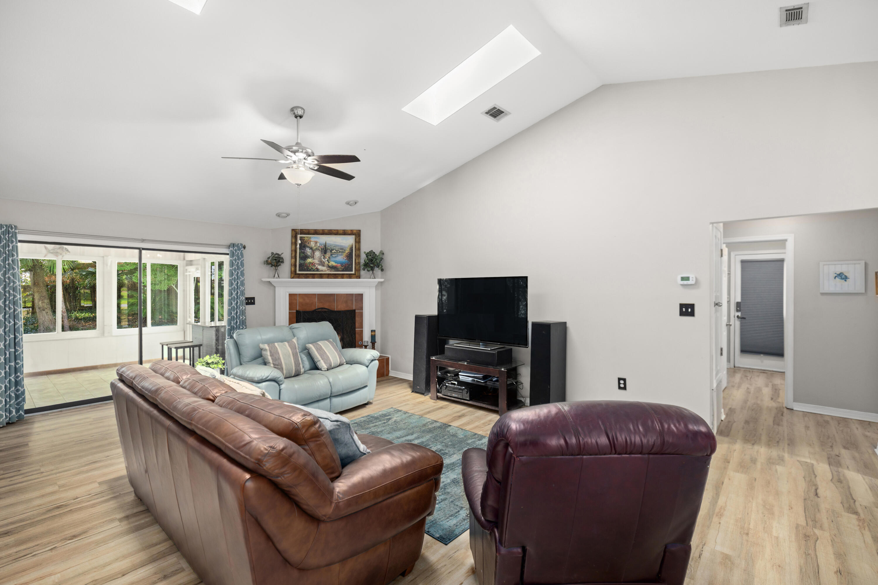 314 Ruckel Drive Niceville, FL 32578 - Photo 13 of 66 a living room with furniture a flat screen tv and a fireplace