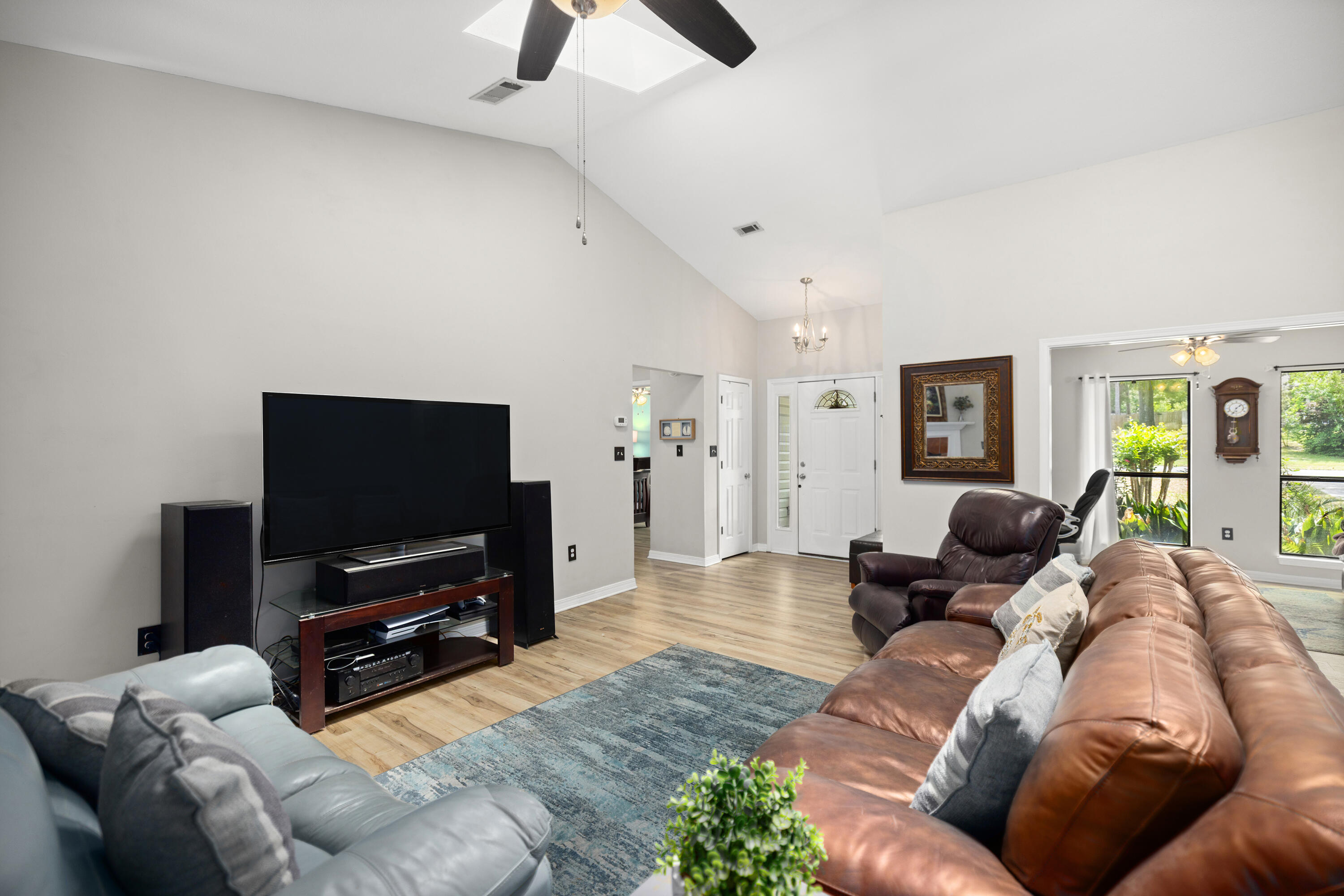 314 Ruckel Drive Niceville, FL 32578 - Photo 16 of 66 a living room with furniture and a flat screen tv