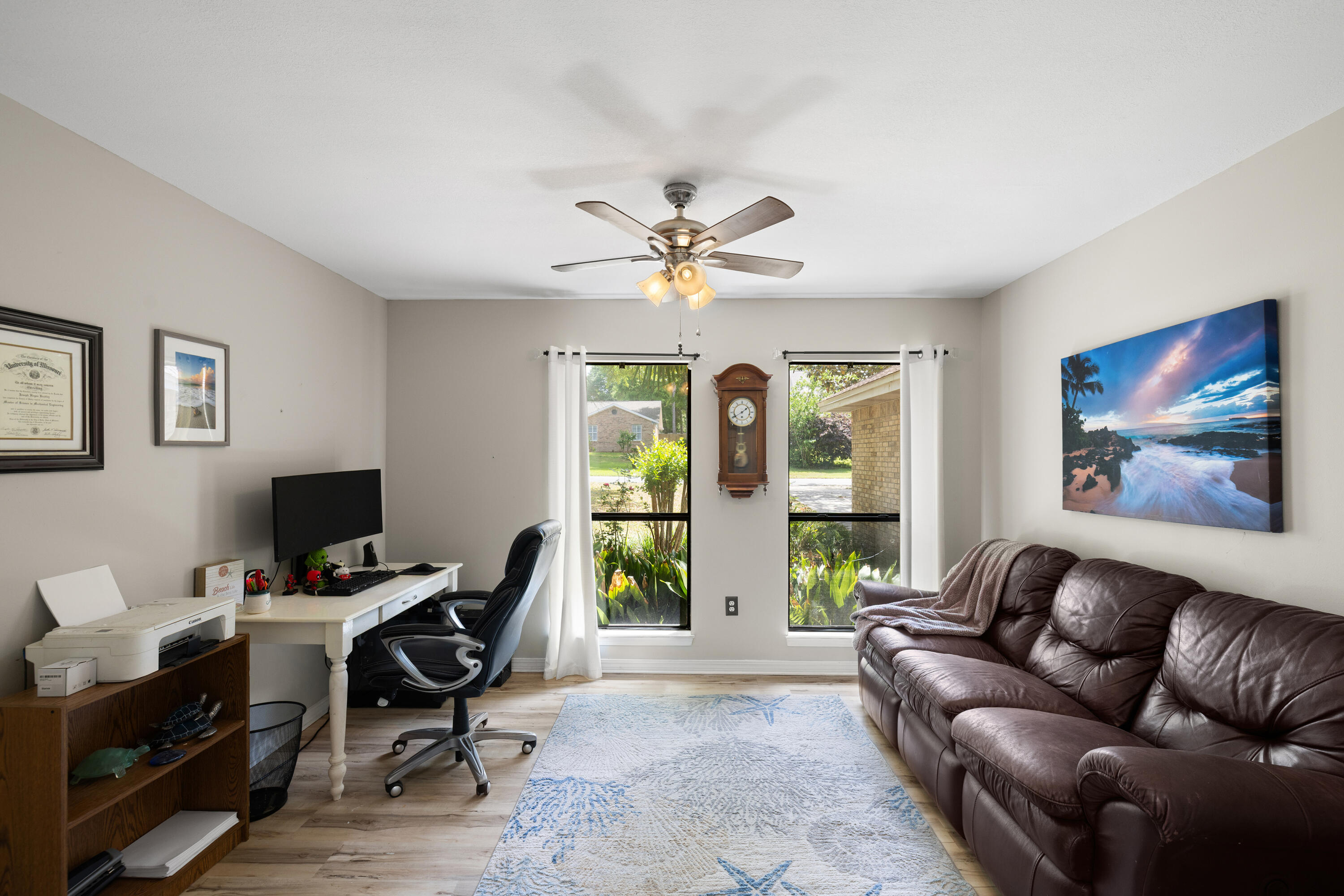 314 Ruckel Drive Niceville, FL 32578 - Photo 27 of 66 a living room with furniture a chandelier and a window