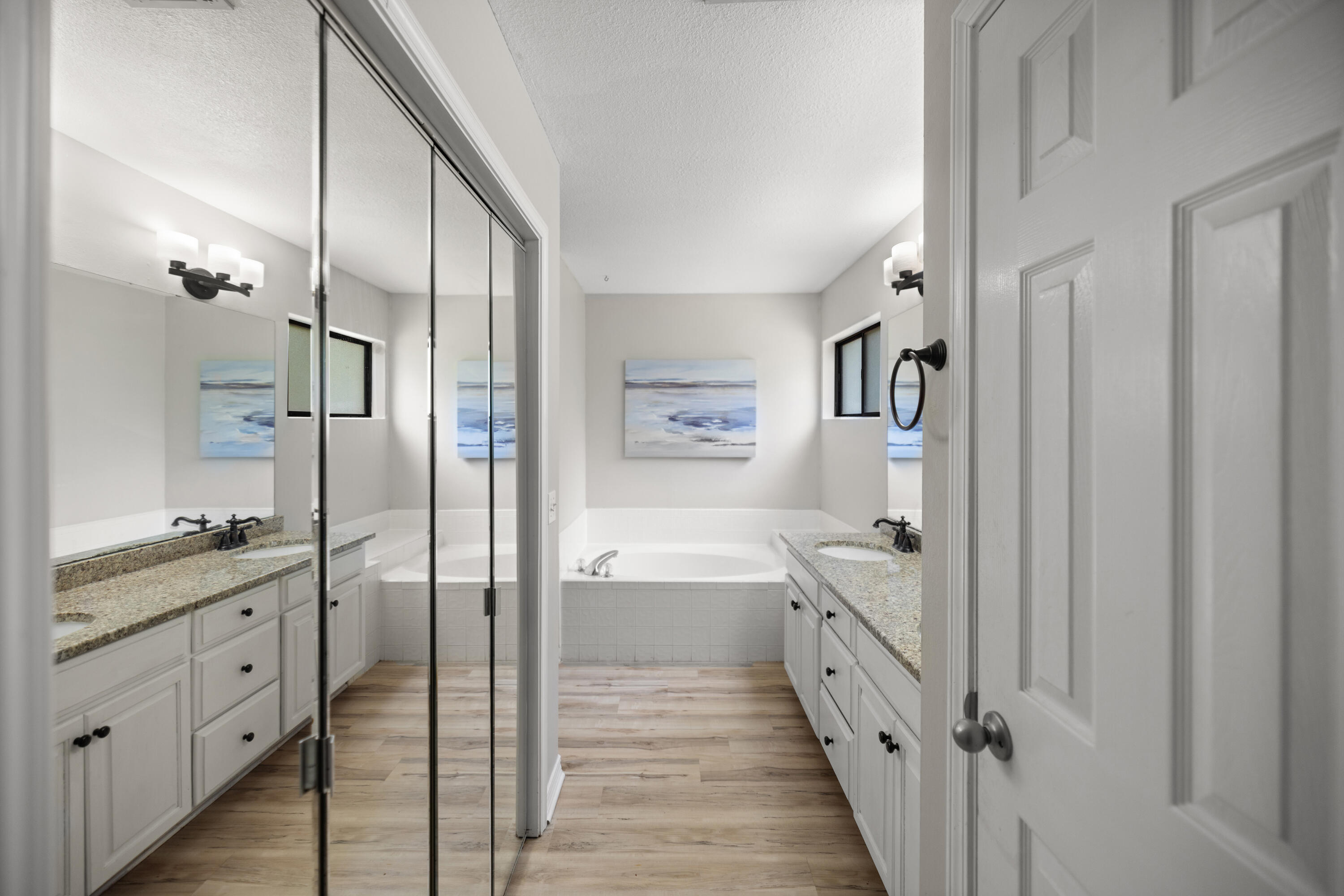 314 Ruckel Drive Niceville, FL 32578 - Photo 32 of 66 a bathroom with a glass door shower a sink and a mirror