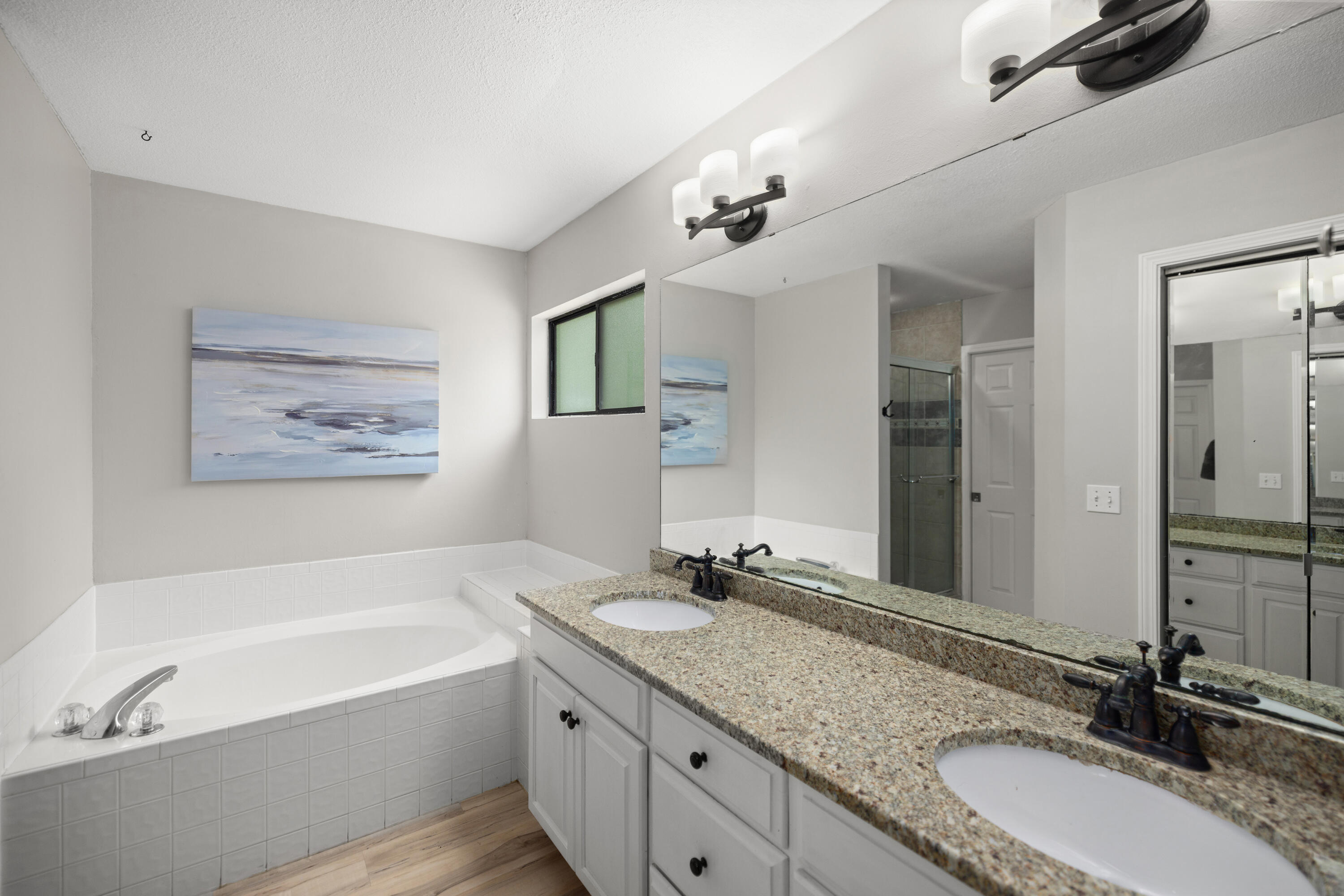 314 Ruckel Drive Niceville, FL 32578 - Photo 33 of 66 a bathroom with a granite countertop double vanity sink bathtub and a mirror
